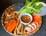 A picture of step 5 of Shrimp, Chicken, Egg, Carrot, and Brown Rice Noodle Spring Rolls.