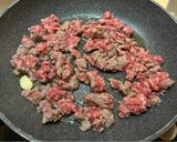A picture of step 1 of Orecchiette with Sausage and Arugula.