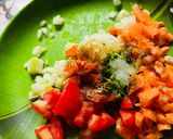 A picture of step 1 of Sprout Salad with carrots cucumber tomatoes.