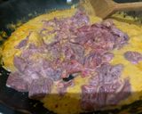 A picture of step 5 of Beef and grilled aubergine red curry topped with Bird eye chillis.
