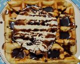 A picture of step 4 of Eggless Waffle with ice cream.