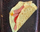 A picture of step 2 of Tortilla and egg sausage wrap.