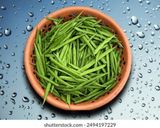 A picture of step 1 of Cluster Beans Cooked in Coconut Milk (Pressure Cooker).