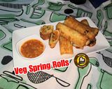 A picture of step 10 of Veg Spring Rolls with homemade sheets and sauce.
