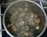 A picture of step 3 of Steamed Snails with Lemongrass and Lime Leaves - Ginger Fish Sauce Dip.