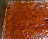 A picture of step 7 of Karidopita with pudding and chocolate glaze.