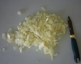 A picture of step 2 of Shakshuka with Onions and Tomatoes.