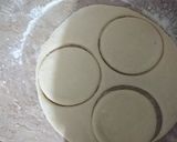 A picture of step 2 of Chocolate Donuts filled with custard.