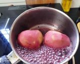 A picture of step 4 of Poached Pears in Red wine with Ice cream.