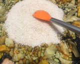 Foto del paso 7 de la receta: Arroz en paella de costillas con alcachofas y habitas
