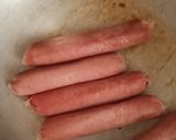 A picture of step 2 of Sumptuos Fried Beef Sausages using very little oil.