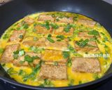 A picture of step 7 of Pan-Fried Tofu and Eggs with Oyster Sauce.