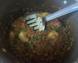 A picture of step 2 of Mutton mince with potato green peas.