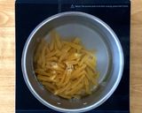 A picture of step 2 of Sausage pasta bake in tomato cream sauce.