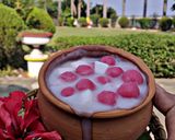 A picture of step 16 of Hibiscus Thai rice balls dunk in coconut milk.