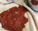 Foto del paso 3 de la receta: Tomates deshidratados en conserva de ajo asado albahacas frescas y orégano