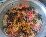 A picture of step 8 of Smokey tandoori chicken drumsticks biryani with mint mango raita.