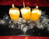 A picture of step 4 of Grapes orange yogurt popsicles.