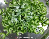 A picture of step 1 of Kaju Karela.