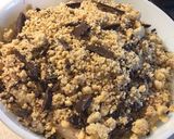A picture of step 4 of Pear, Hazelnut & Bournville Dark Chocolate Crumble 🍐🍫.