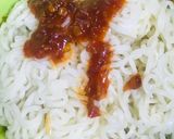 A picture of step 1 of Chicken schezwan Maggi noodles and tossed boiled egg with Maggi seasoning.
