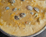 Foto del paso 7 de la receta: Estofado de alcachofas, almejas y langostinos