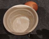 A picture of step 1 of Microwave Egg Cocotte with Bacon and Chives.