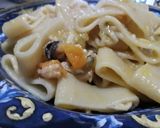 Foto del passaggio 8 della ricetta Calamarata con prontomare e sugo di pomodorini gialli
