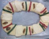 A picture of step 5 of Rosca de Reyes Filled with Cream and Fruit.