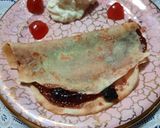 Foto del paso 3 de la receta: Panqueque flambeado con mermelada de arándanos y yogurt