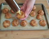 Foto del passaggio 11 della ricetta Bignè con crema al caffè e cioccolato