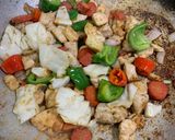 A picture of step 5 of Almonds and cashew nut chicken.