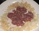 Foto del paso 4 de la receta: Zapallitos rellenos con arroz y carne picada