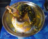 A picture of step 1 of Muri Ghonto (Fish head curry with lentils).