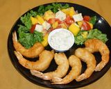 A picture of step 10 of Beer-Battered Fried Shrimp with Mango and Goat Cheese Salad.