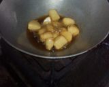 A picture of step 11 of Aloo fulcopi katla rosha ar misti doi.