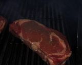 A picture of step 1 of 3 inch thick ribeye steak on BBQ.