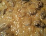 A picture of step 10 of Smothered Chicken Liver over French Fries.