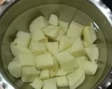 A picture of step 1 of Cheesey Spicy Garlic Potato.
