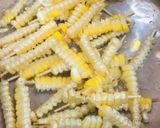 A picture of step 2 of Masala corn fries.