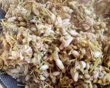 A picture of step 1 of Sahjan ke phul ka saag (drumstick flower curry).