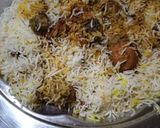 A picture of step 11 of Kache chicken ki biryani.