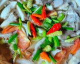 A picture of step 4 of Tom Yum Soup with Mushrooms and Shrimp.