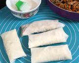 A picture of step 11 of Chicken Salami Spring Rolls.