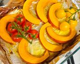 A picture of step 2 of Pumpkin in the oven with tomatoes.