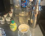 A picture of step 2 of Lemon drop martini style drink.