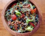 A picture of step 1 of Green Salad with Strawberries, Blueberries, and Savory Granola.