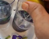A picture of step 2 of Blue pea magic layered mocktail.