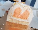 A picture of step 12 of Grand Marnier Bûche de Noël with Mandarin Insert.