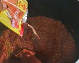 A picture of step 7 of Coconut party jollof rice.
